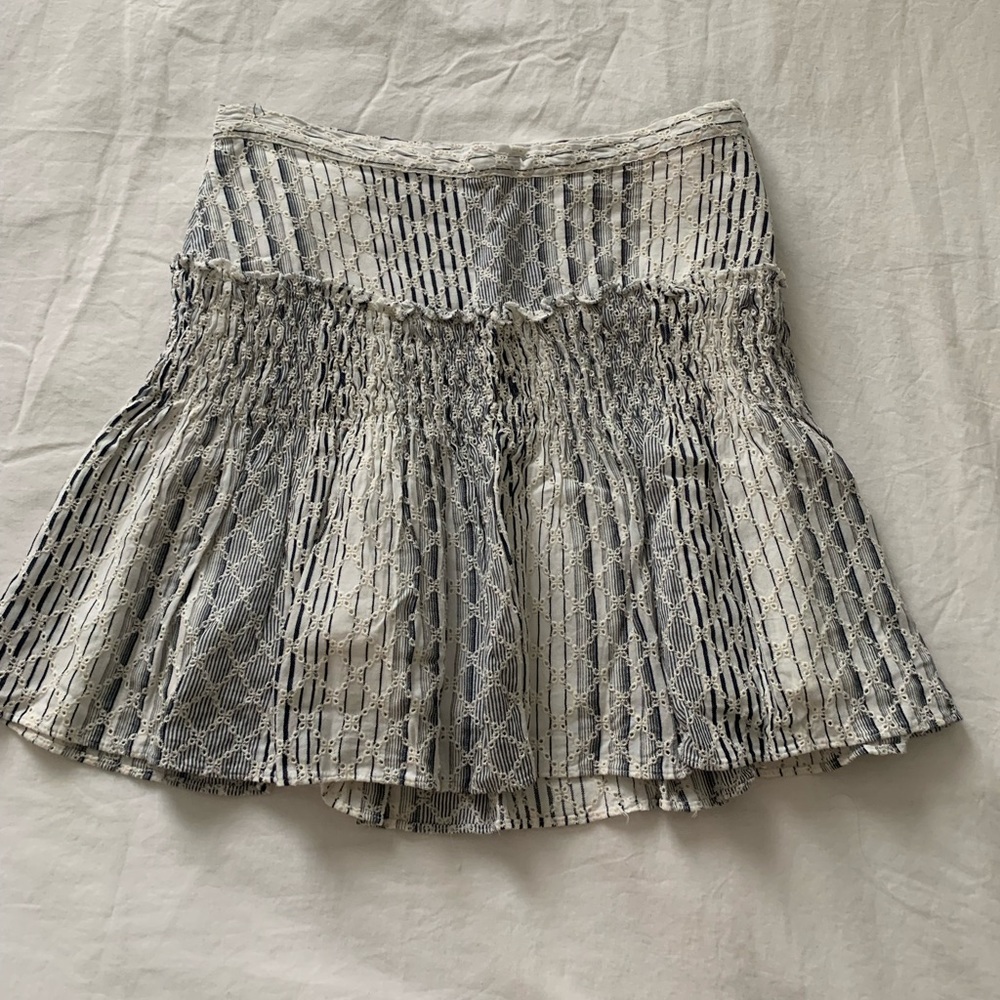 Grey and white eyelet skirt with minimal ruffles/gathering at hip